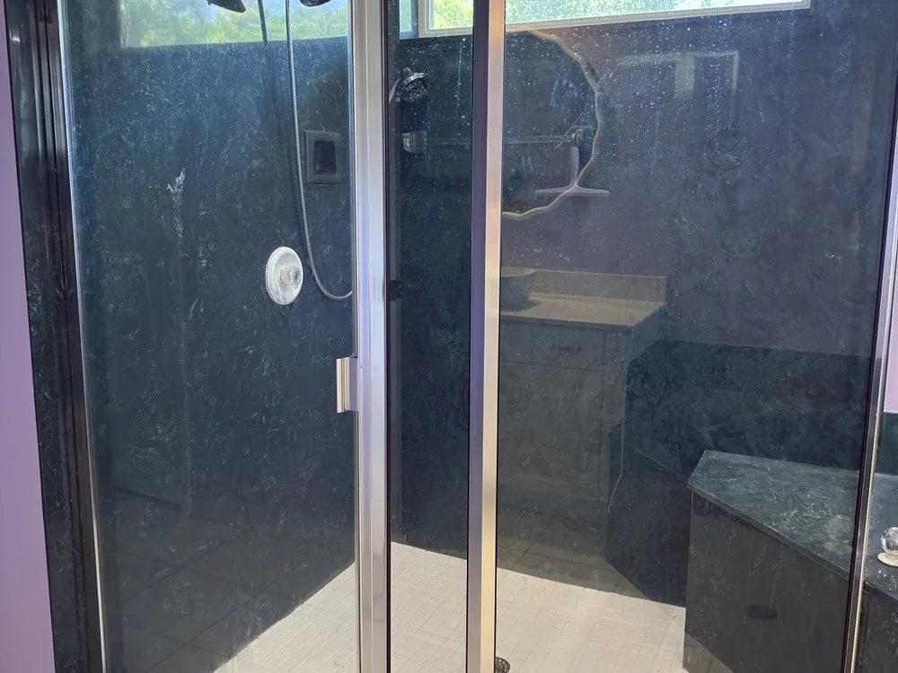 Glass shower before cleaning by Ocean View, Stuart FL